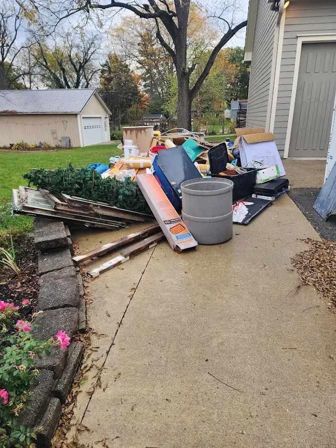 Dumpster being loaded with debris for Roofing Dumpster Rental in West Valley City